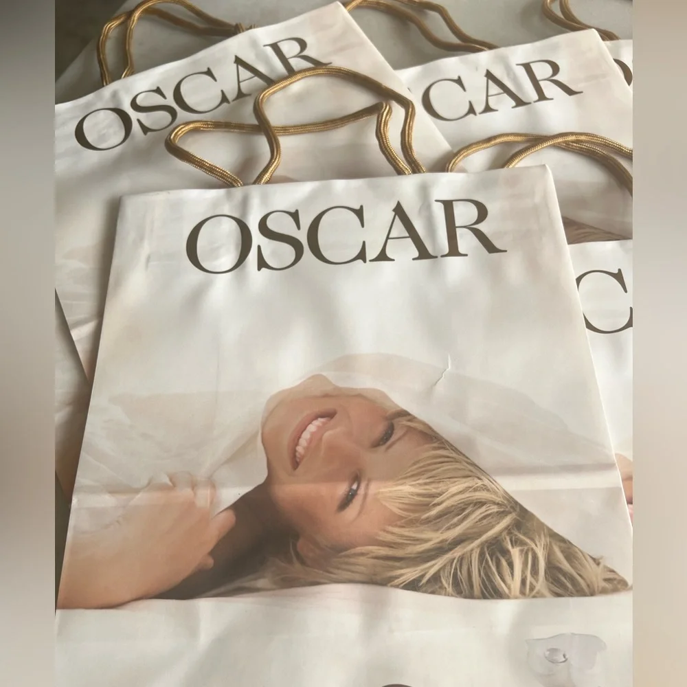 Oscar de la Renta gift bags with gold tone handles. New never used. Total 10.
